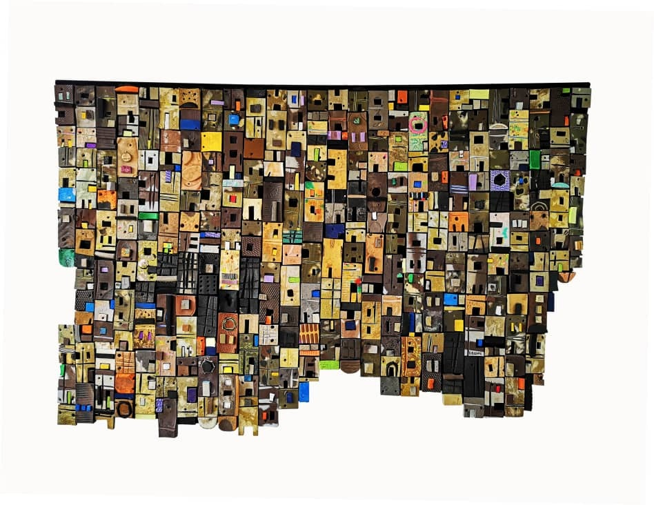 village by Patrick Patrick Tagoe-Turkson: Village/ Tsenaha, 2020, kasserede klip-klappere på skind, 128 x 192 cm.<br/>
”Gentle steps will lead you to the far country, where you find heaven at every junction”.